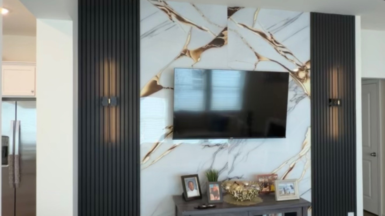 Living room accent wall with Black Acoustic Panels and Marble Sheet